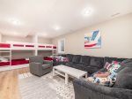 In the lower level, the kids will love their own space with four Full/Double bunk beds plus a hangout area